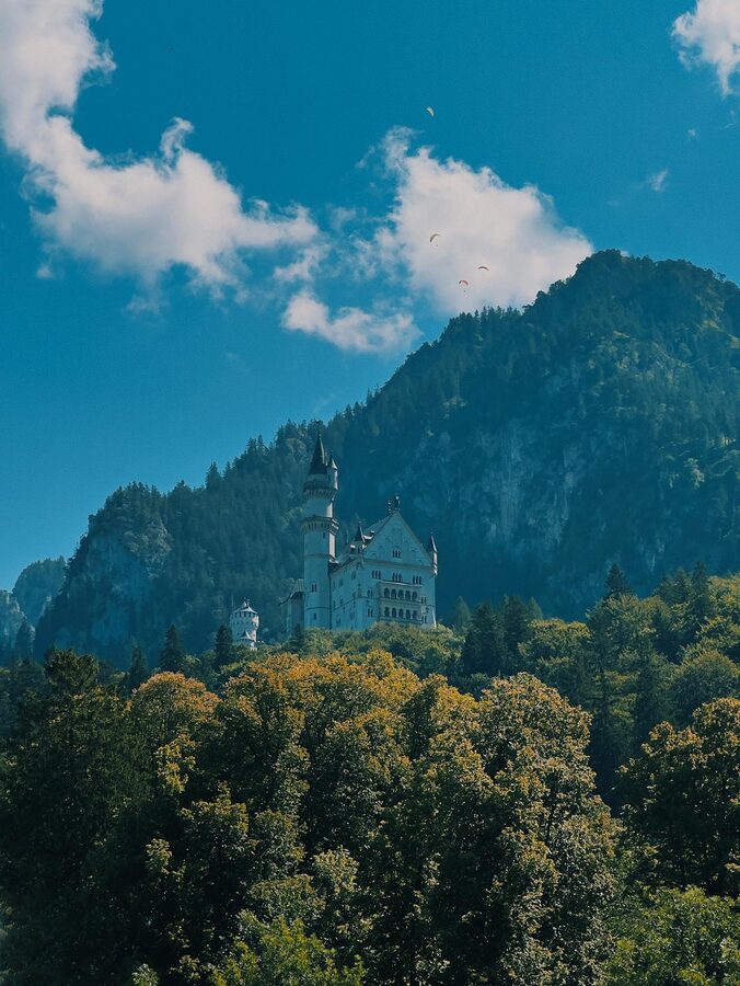 Neuschwanstein Castle with mountains and blue sky