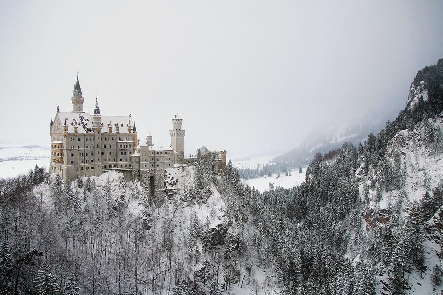 Neuschwanstein Castle winter scene with snow-covered landscape