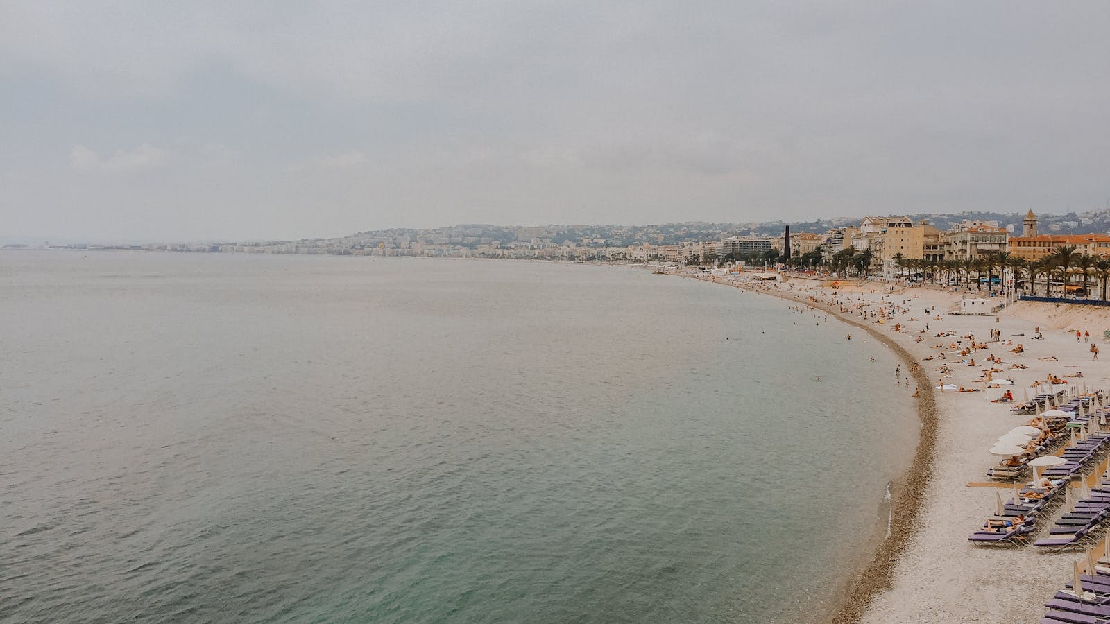 Nice beachfront with azure waters and sandy shores along the French Riviera
