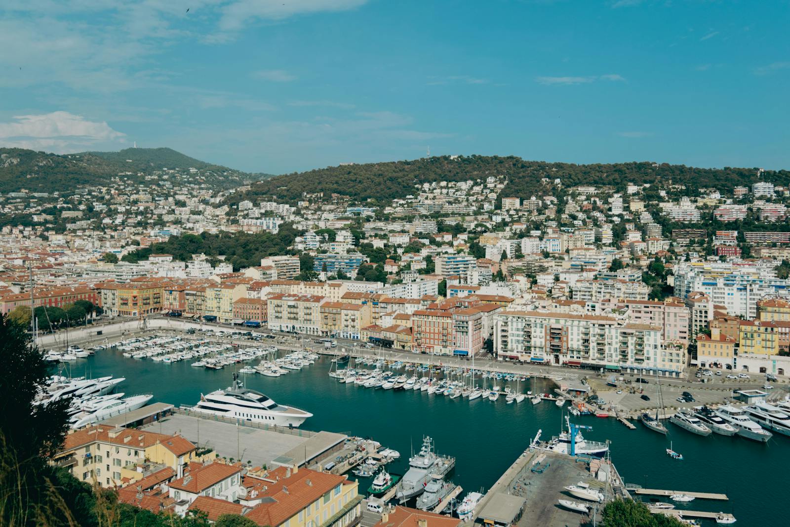 Aerial view of Nice harbor with yachts and hillside architecture in the French Riviera