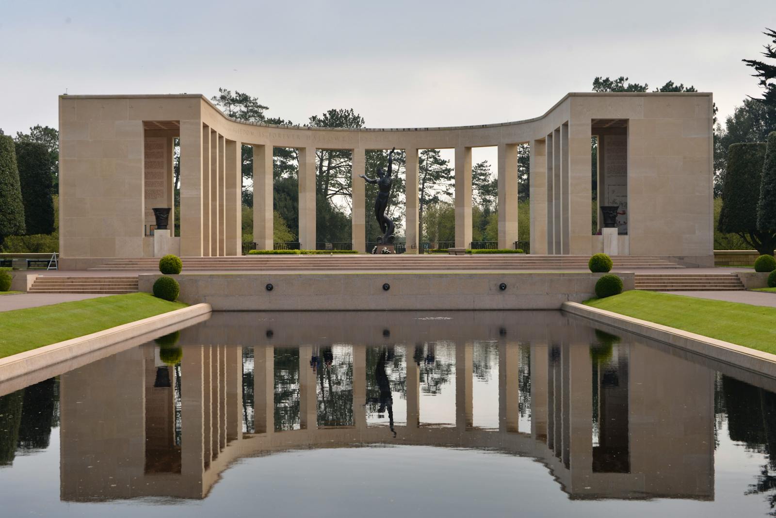 The reflective pool and statue at the Normandy American Cemetery Memorial
