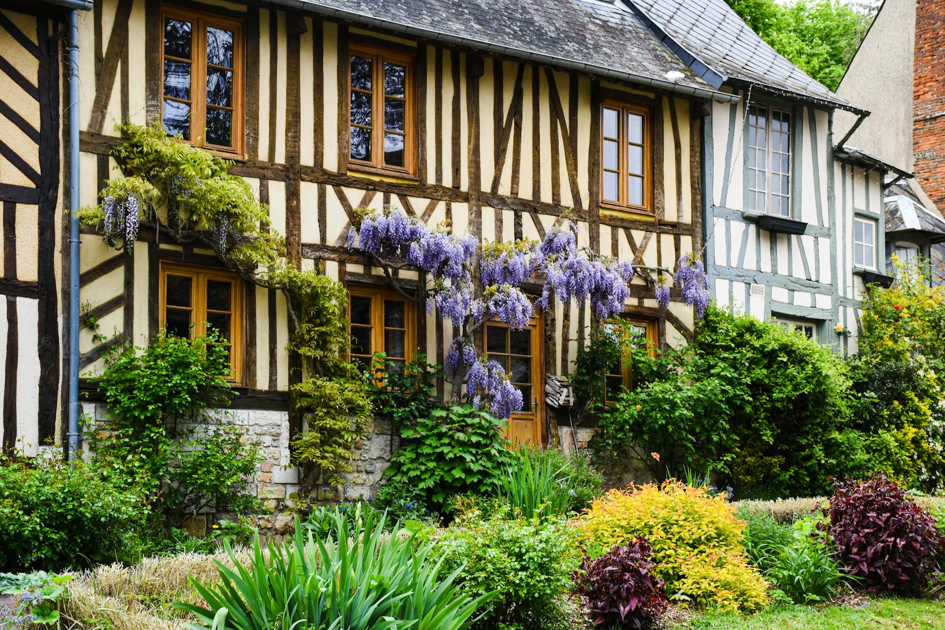 Picturesque half-timbered house with lush garden in Normandy