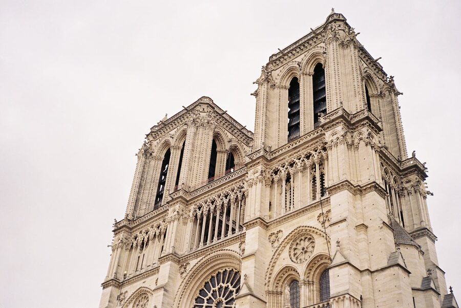 Notre Dame Cathedral bell towers against blue sky