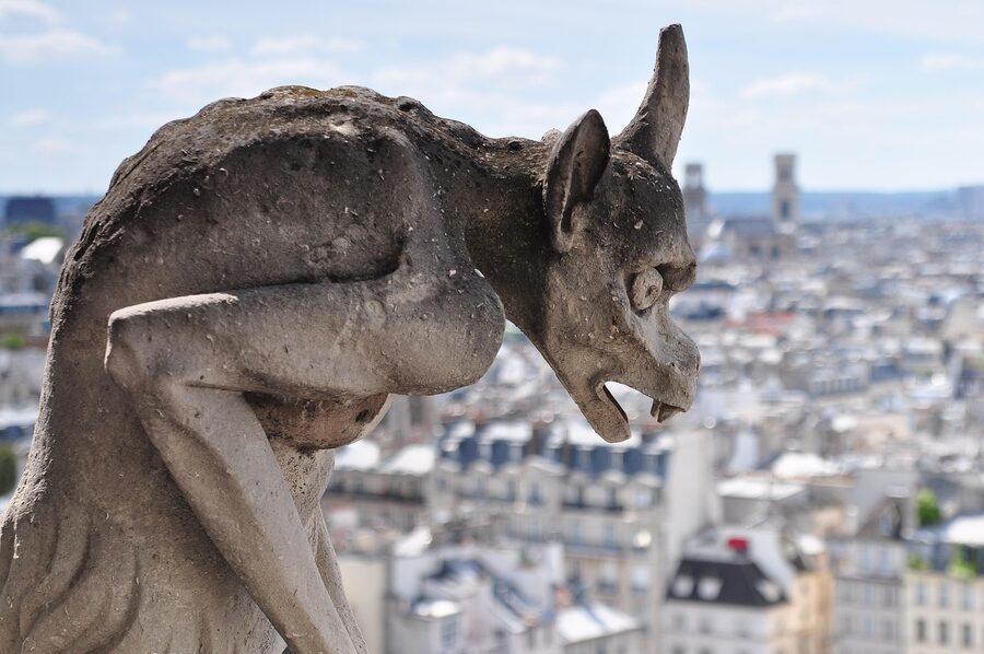 Close-up of a gargoyle statue on Notre Dame Cathedral