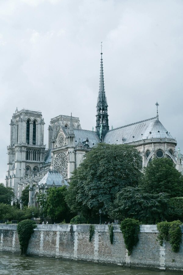 Notre Dame Cathedral lateral side with garden along Seine River
