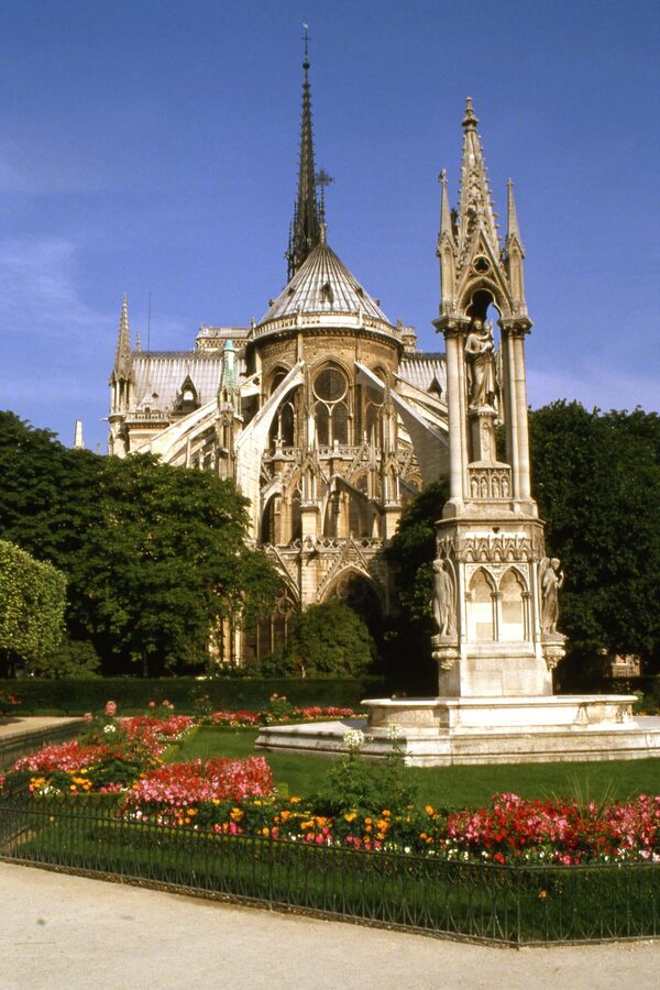 Notre Dame Cathedral and gardens with spring flowers in Paris