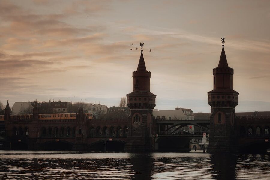 Oberbaum Bridge at sunset with train passing in Berlin