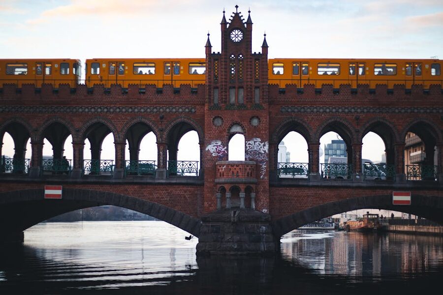 Yellow U-Bahn train crossing Oberbaum Bridge in Berlin