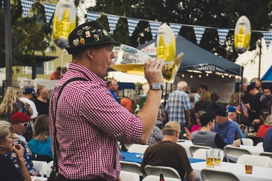 Man enjoying a large beer mug at Oktoberfest