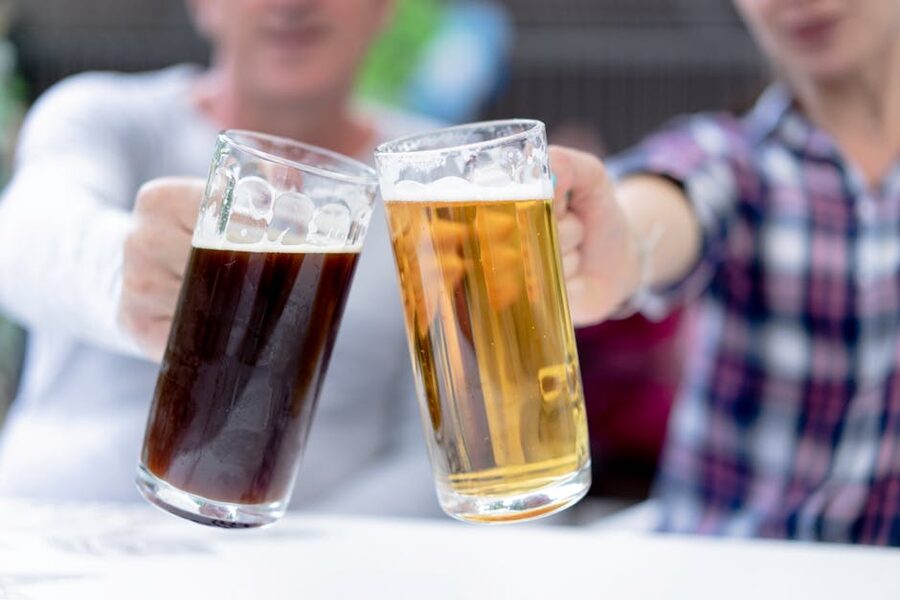 Two men toasting with beer steins at Oktoberfest