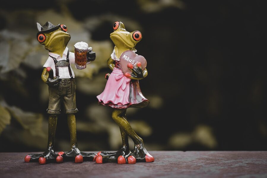 Oktoberfest figures in dirndl and lederhosen