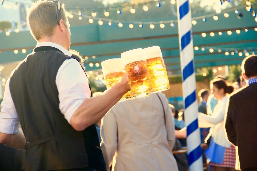 Oktoberfest waiter with multiple beer steins