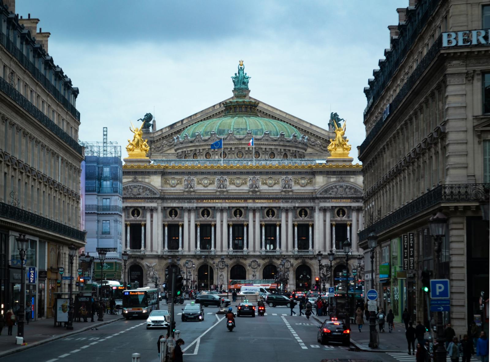 Street scene near the Palais Garnier showing classic Paris urban life