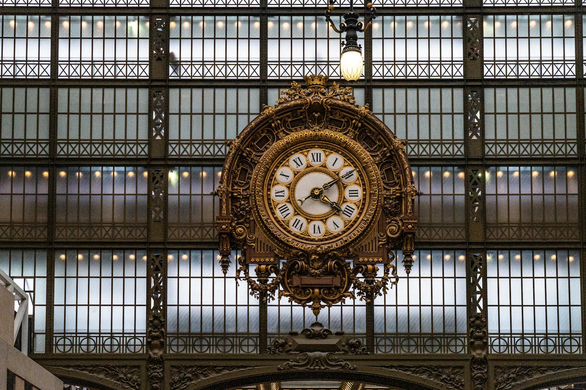 A close-up of the ornate clock inside Musée d'Orsay capturing elegant detail