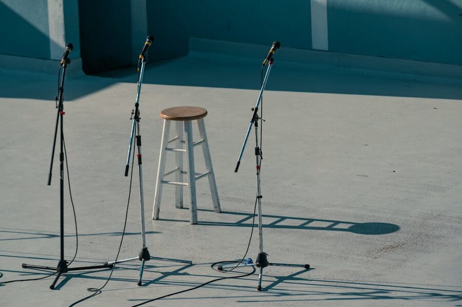 Simple stage setup with bar stool and microphones
