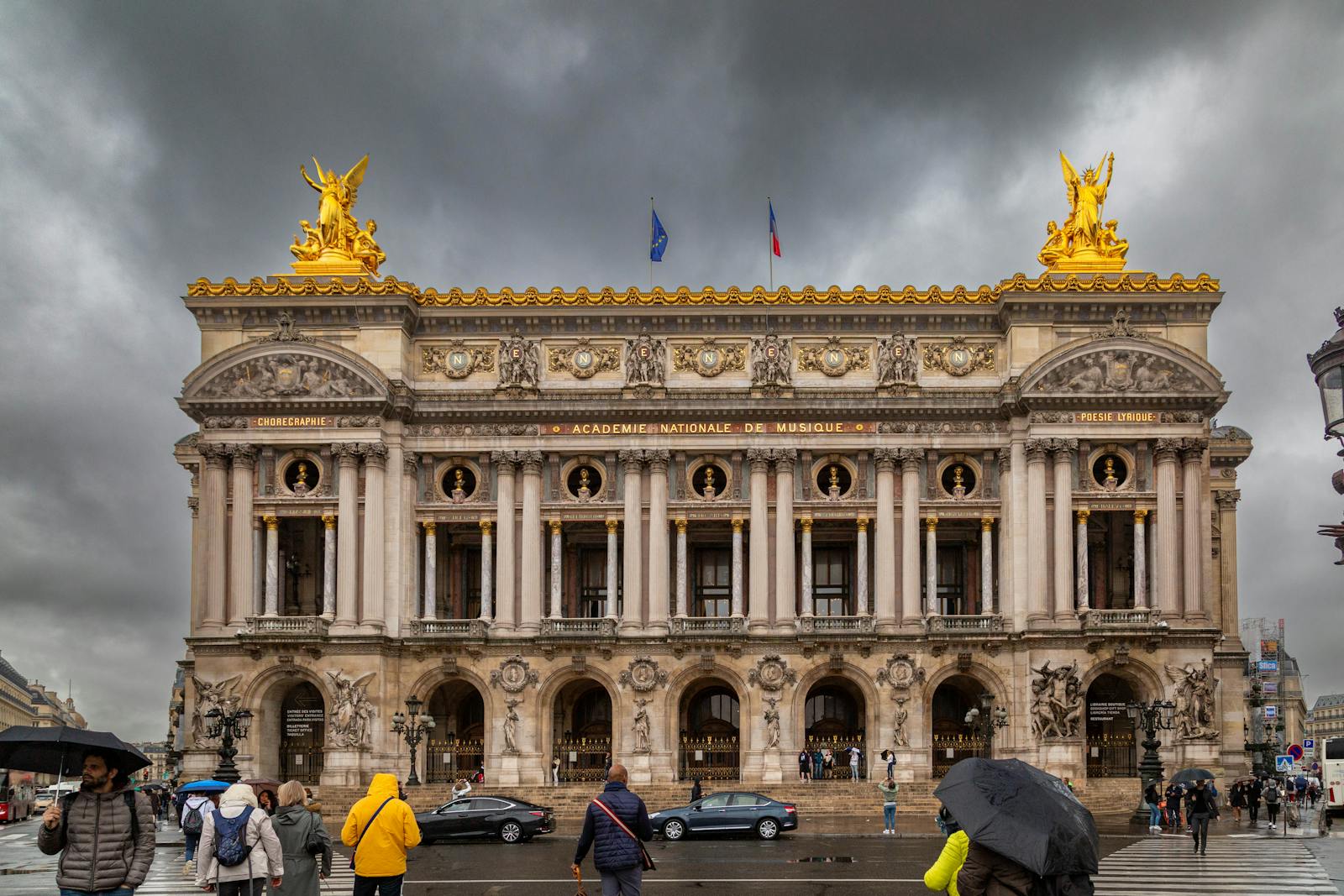 Palais Garnier seen against a dramatic sky showcasing its 19th-century architecture
