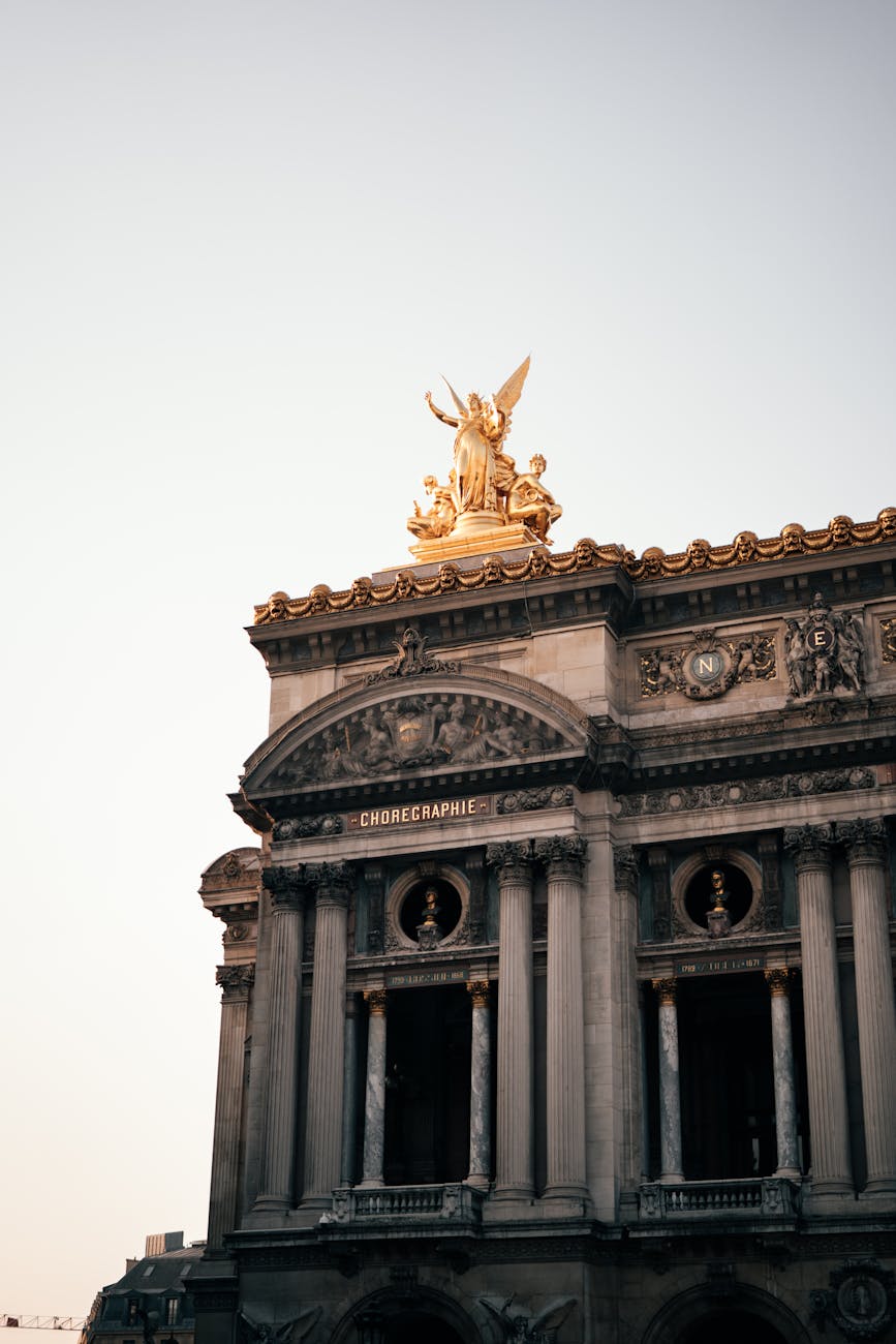 Gilded statues on the facade of Palais Garnier in Paris