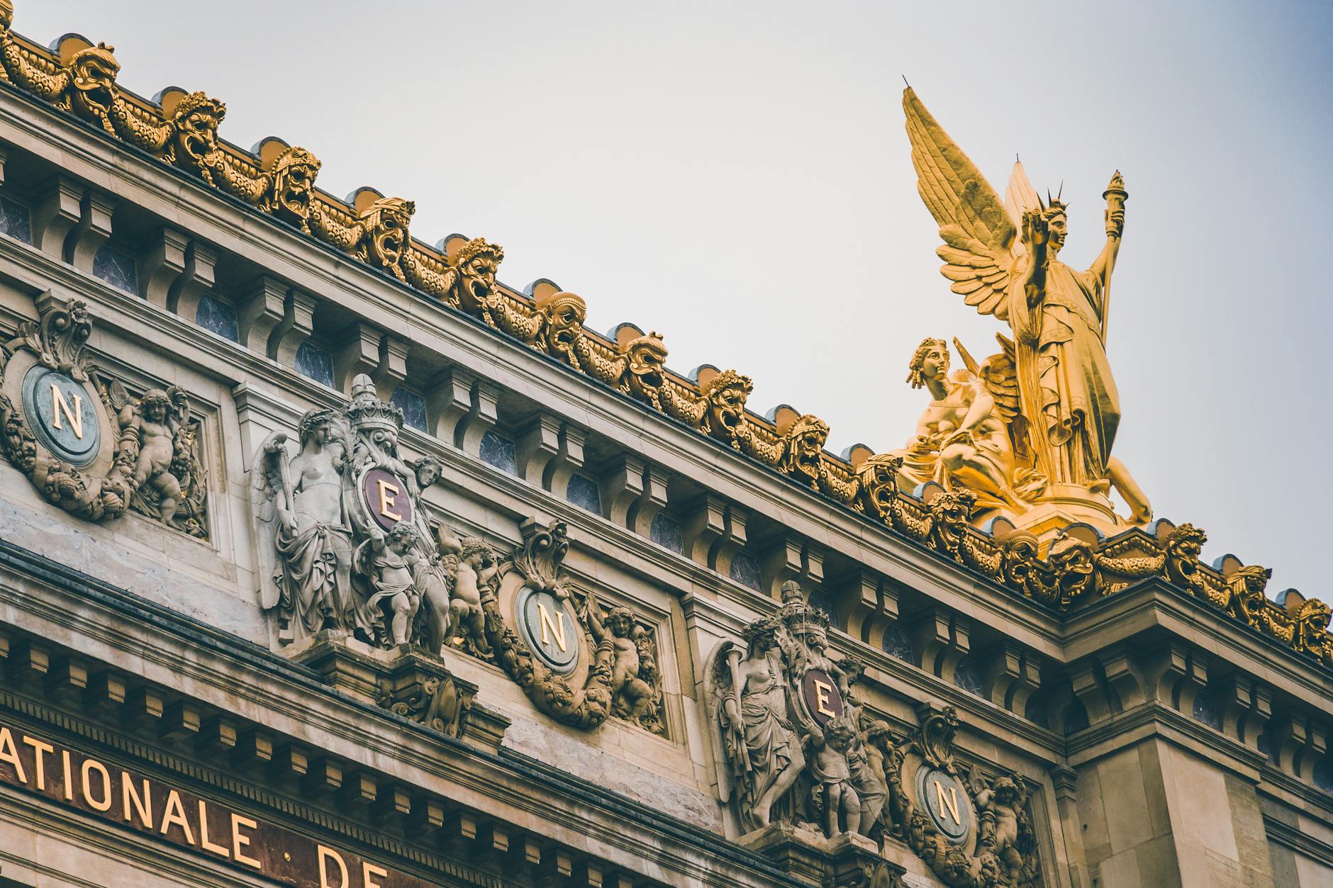Low angle view of golden sculptures at Palais Garnier