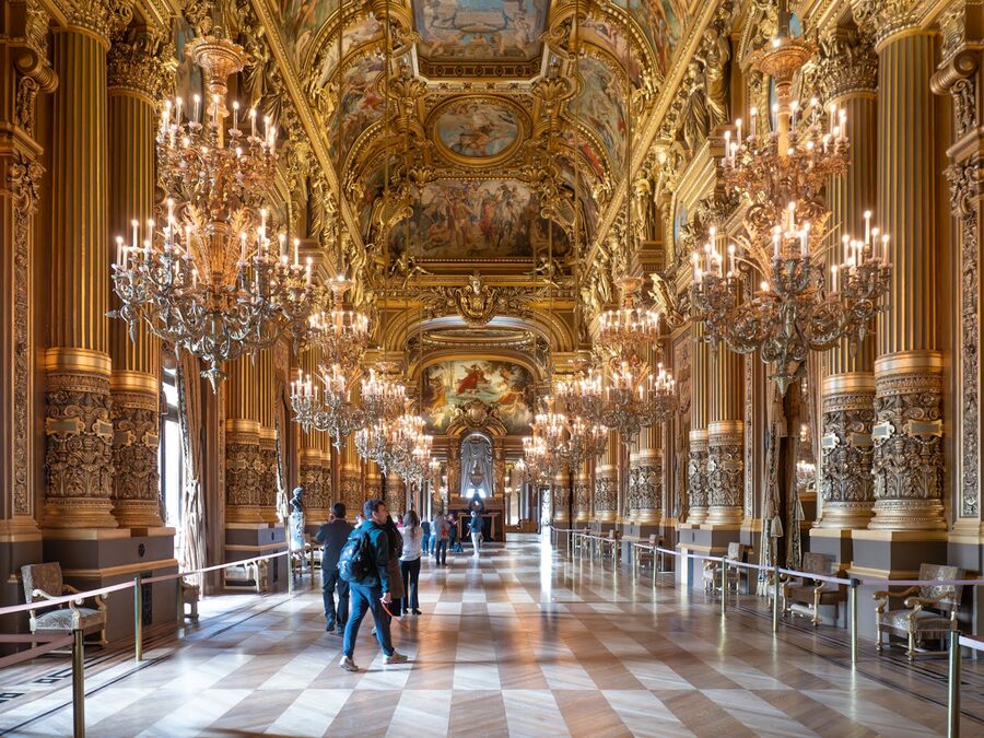 Stunning ornate interior of Palais Garnier with chandeliers
