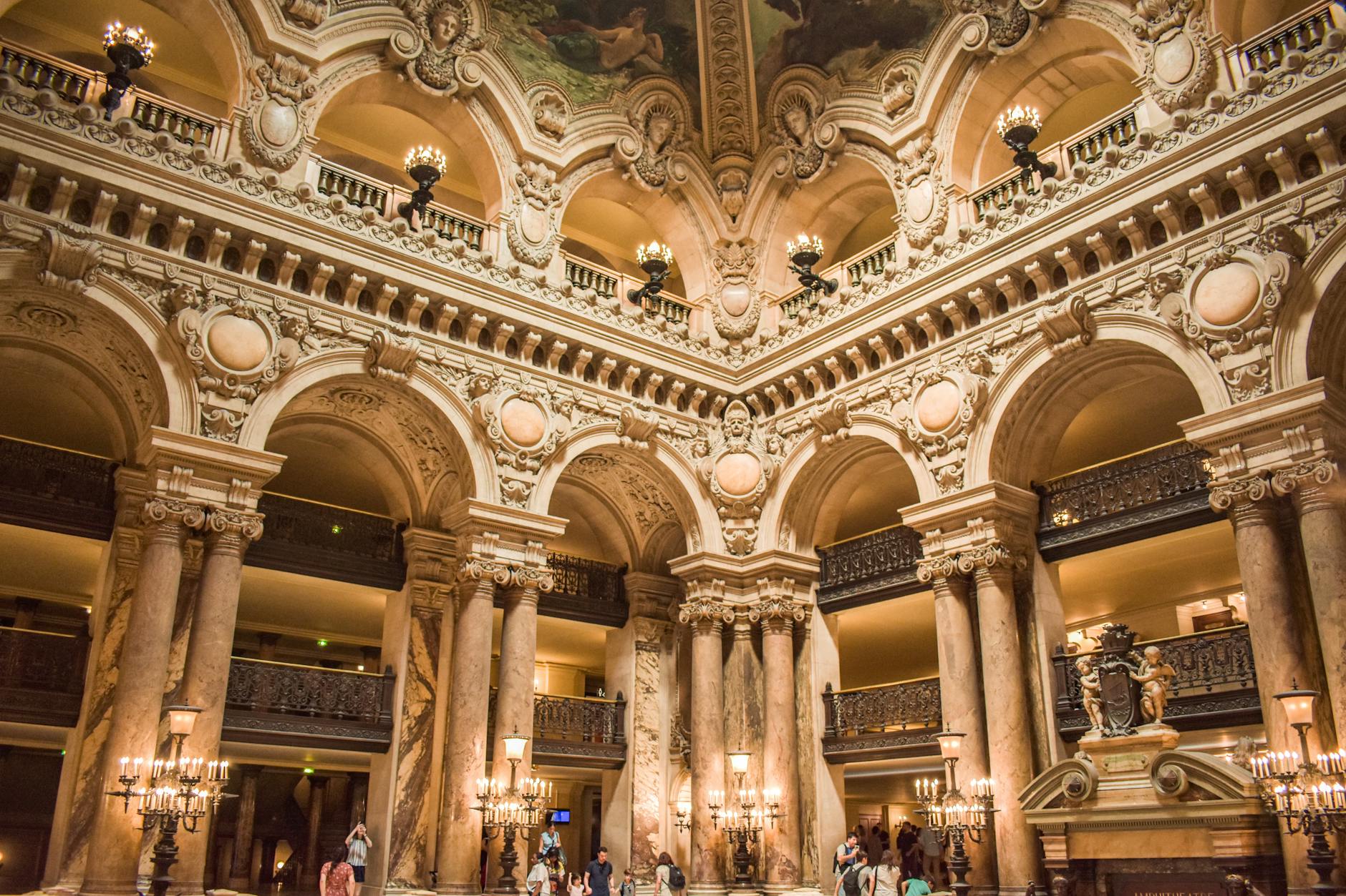 Ornate historical interior of Palais Garnier showing sculpture and detail