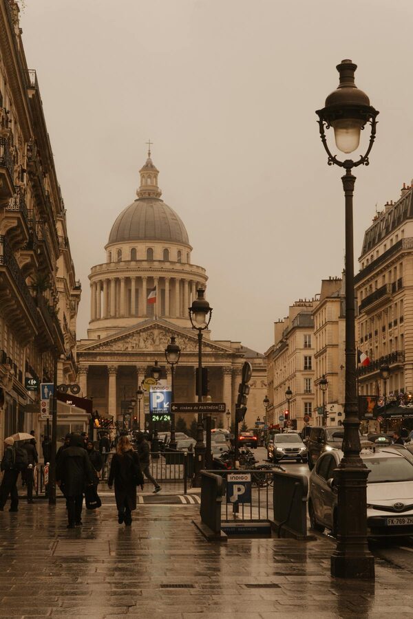 Parisian street scene with Pantheon under overcast sky