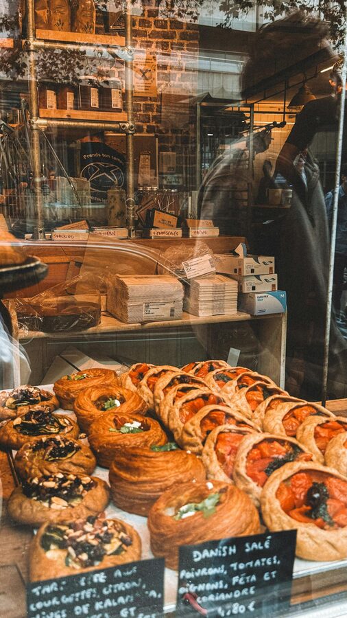 Parisian bakery window showcasing a variety of pastries