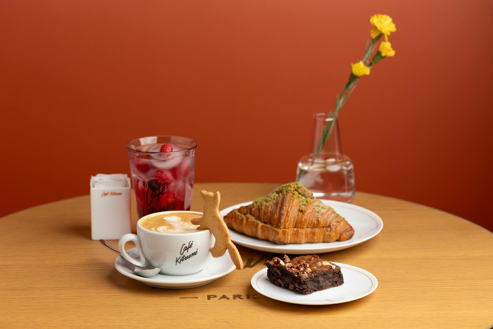 Elegant Paris café scene with coffee and a fresh croissant on a marble table