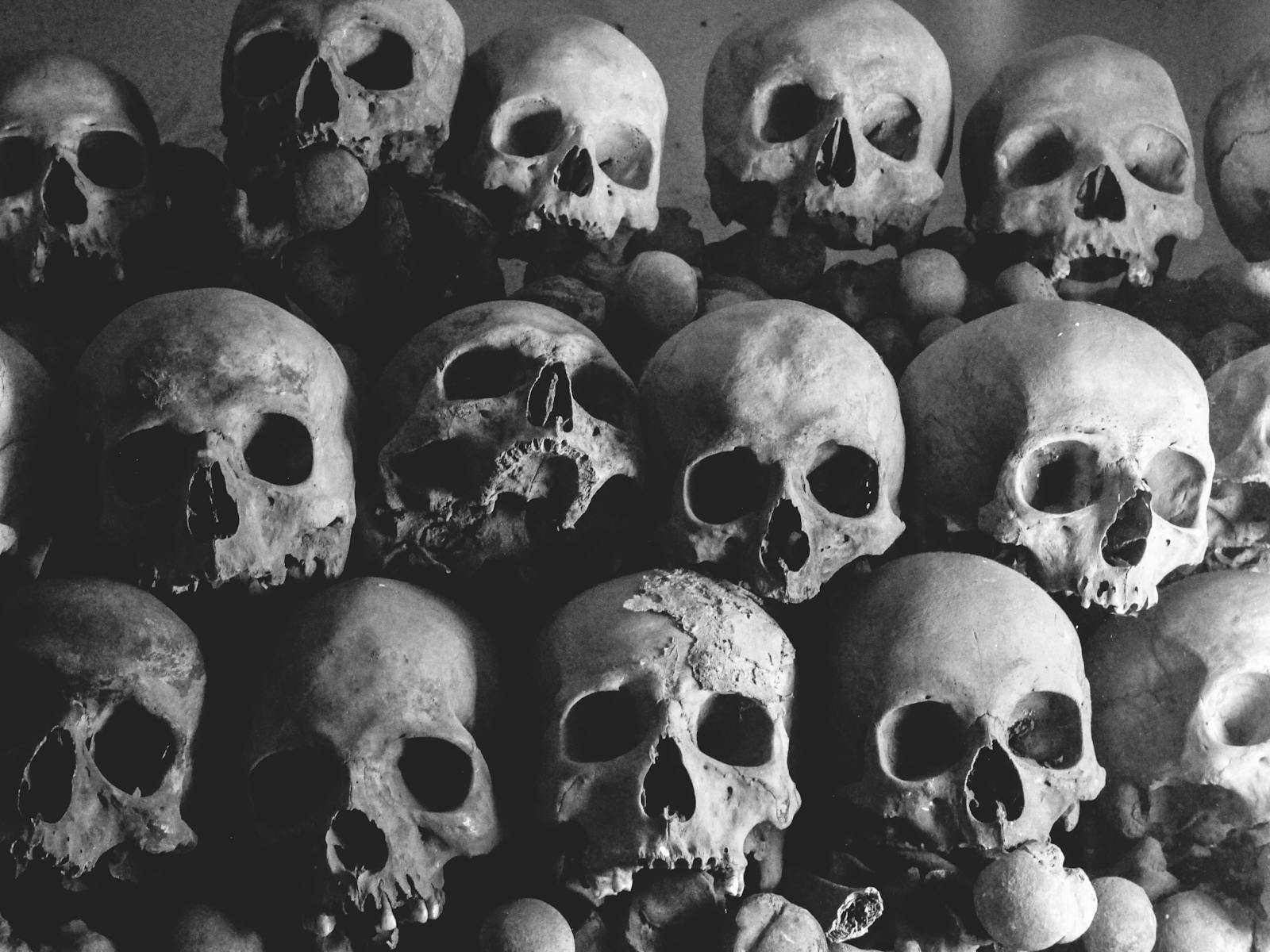 Atmospheric pile of human skulls inside the Paris Catacombs
