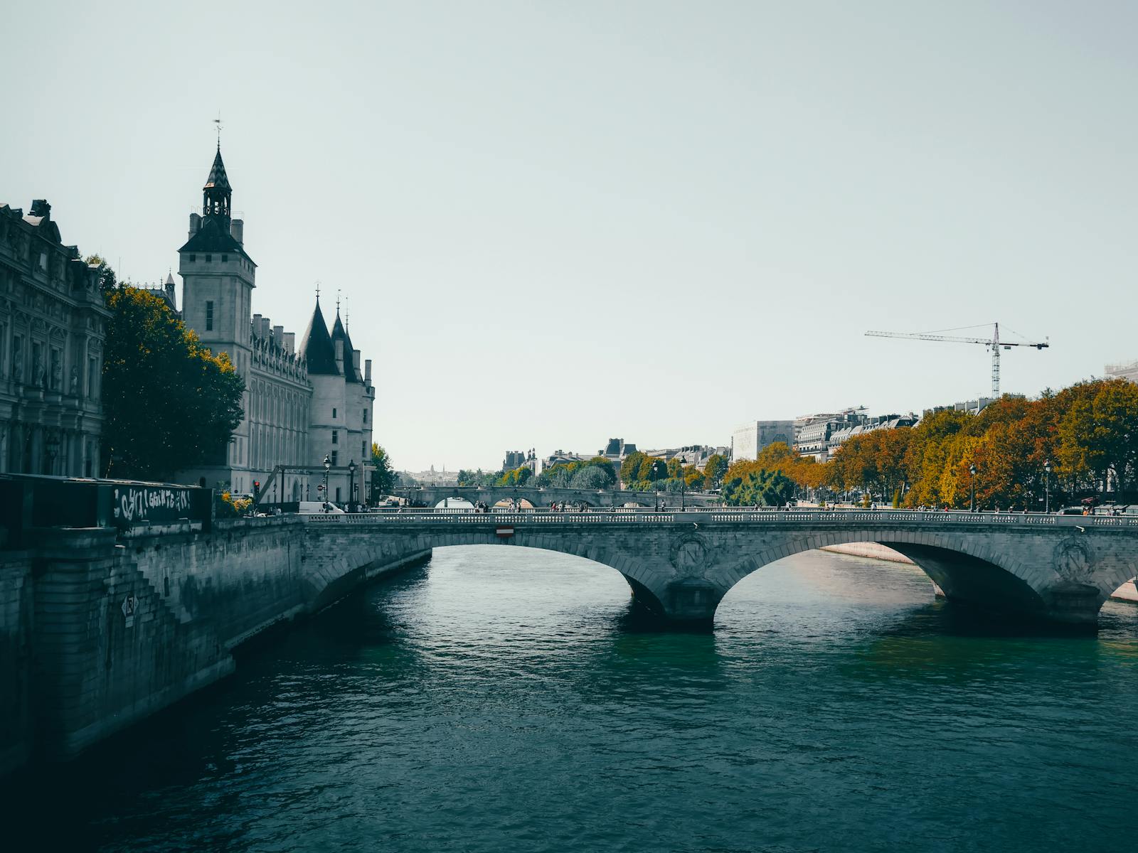 Paris Conciergerie and historic bridge over the Seine River