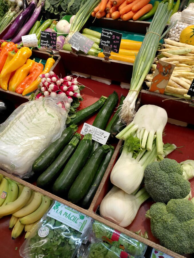 Fresh vegetables on display at a Paris market stall