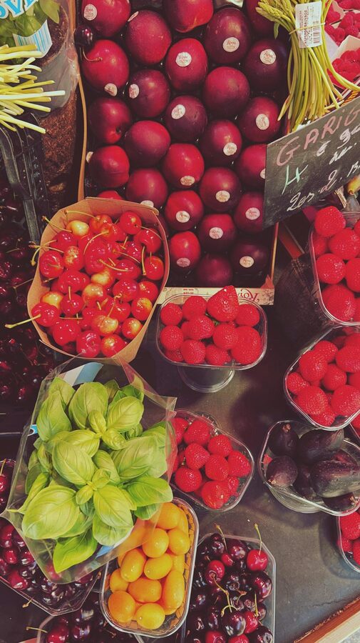 Fresh fruits and garlic displayed at a Paris market