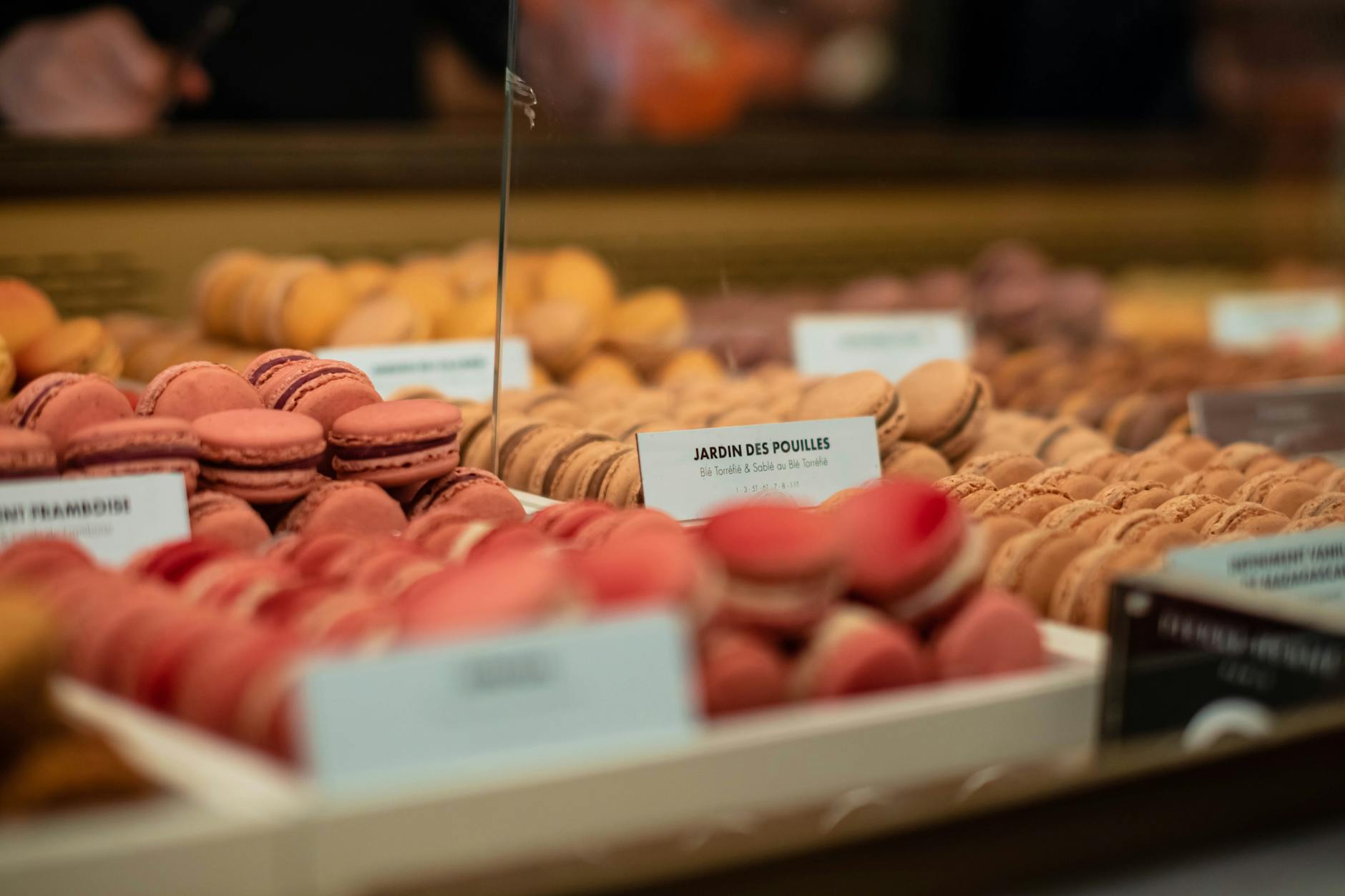 Paris market bakery with macarons in various flavours on display