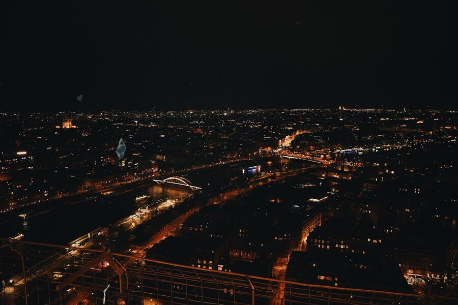 Night view of Paris with illuminated bridges and streets from above