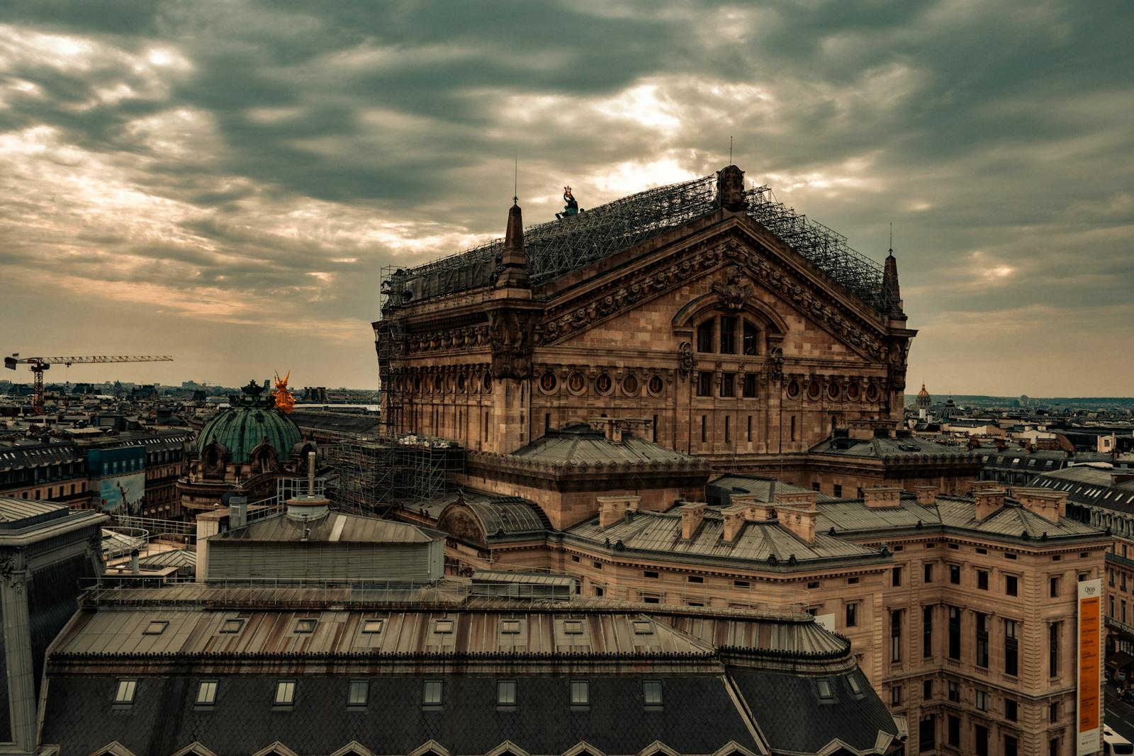 Aerial view of the Palais Garnier rooftop bathed in sunset light