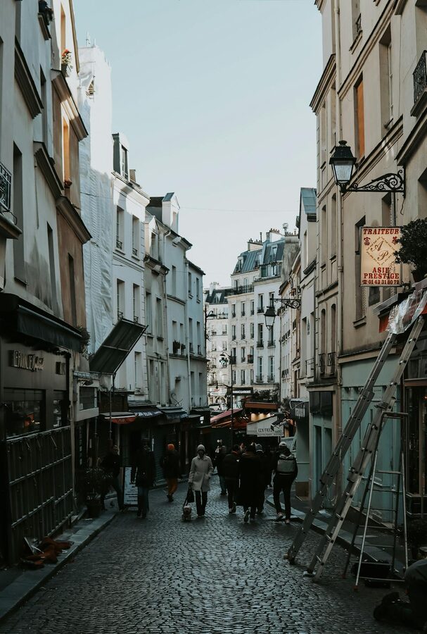 People walking on a quaint Parisian street