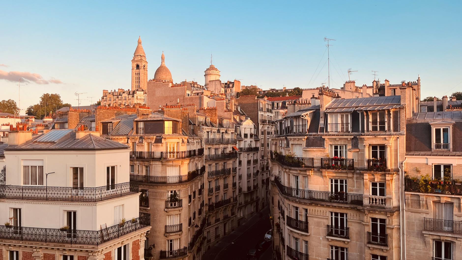 View of historic Paris rooftops with Sacré-Cœur Basilica