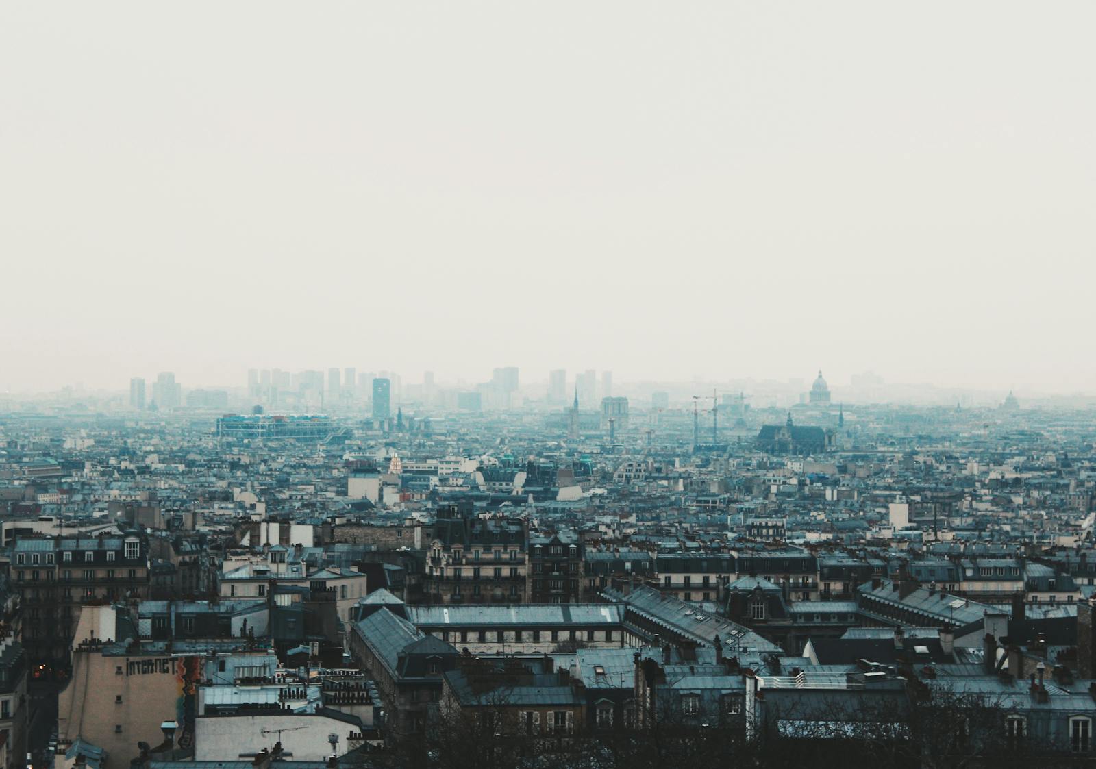 Aerial view of the Paris skyline at twilight with iconic architecture