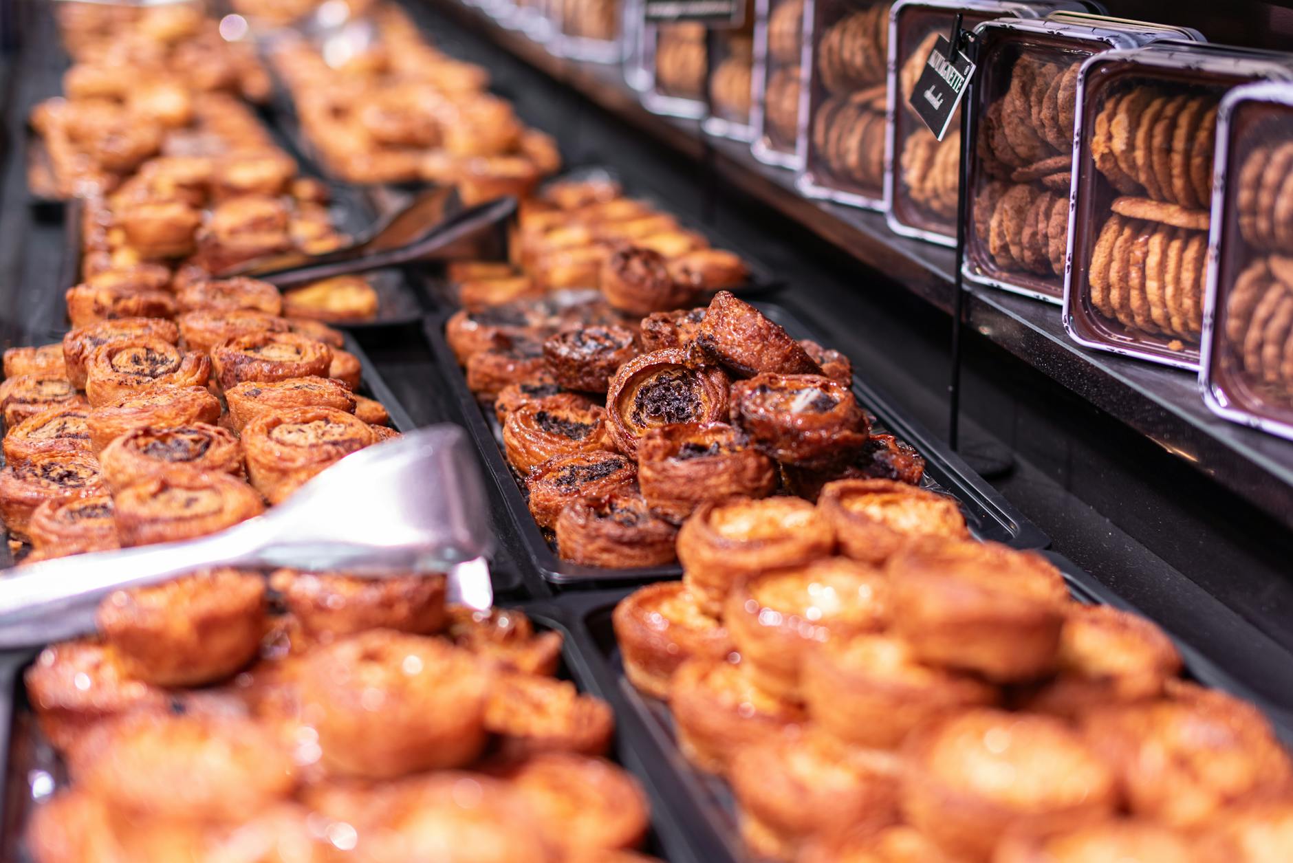 Crafted pastries and cookies on display in a Parisian bakery with charm