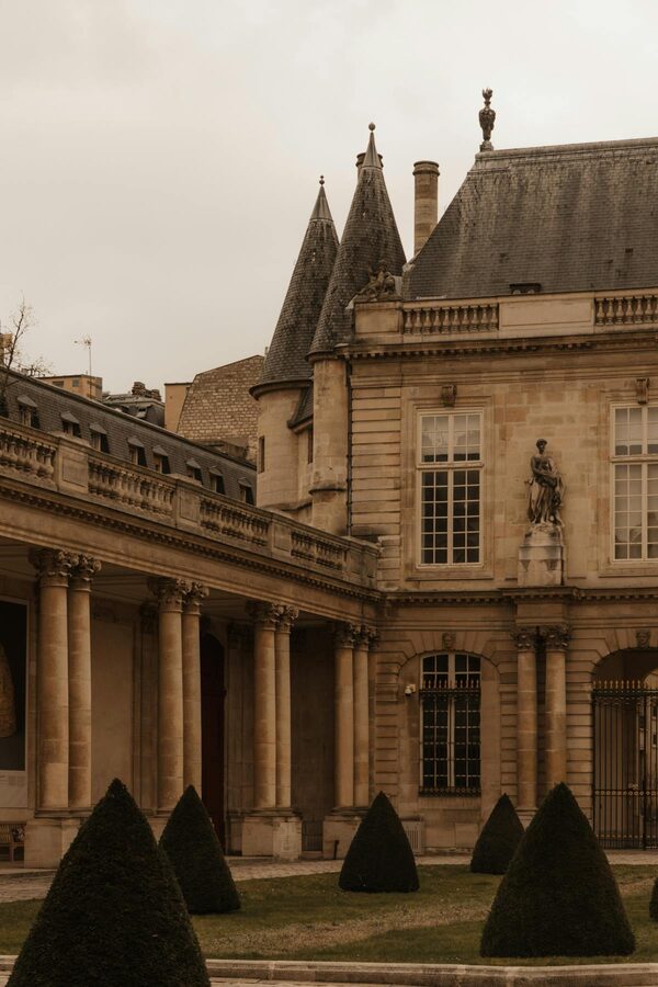 Elegant Parisian courtyard with classical architecture and symmetry