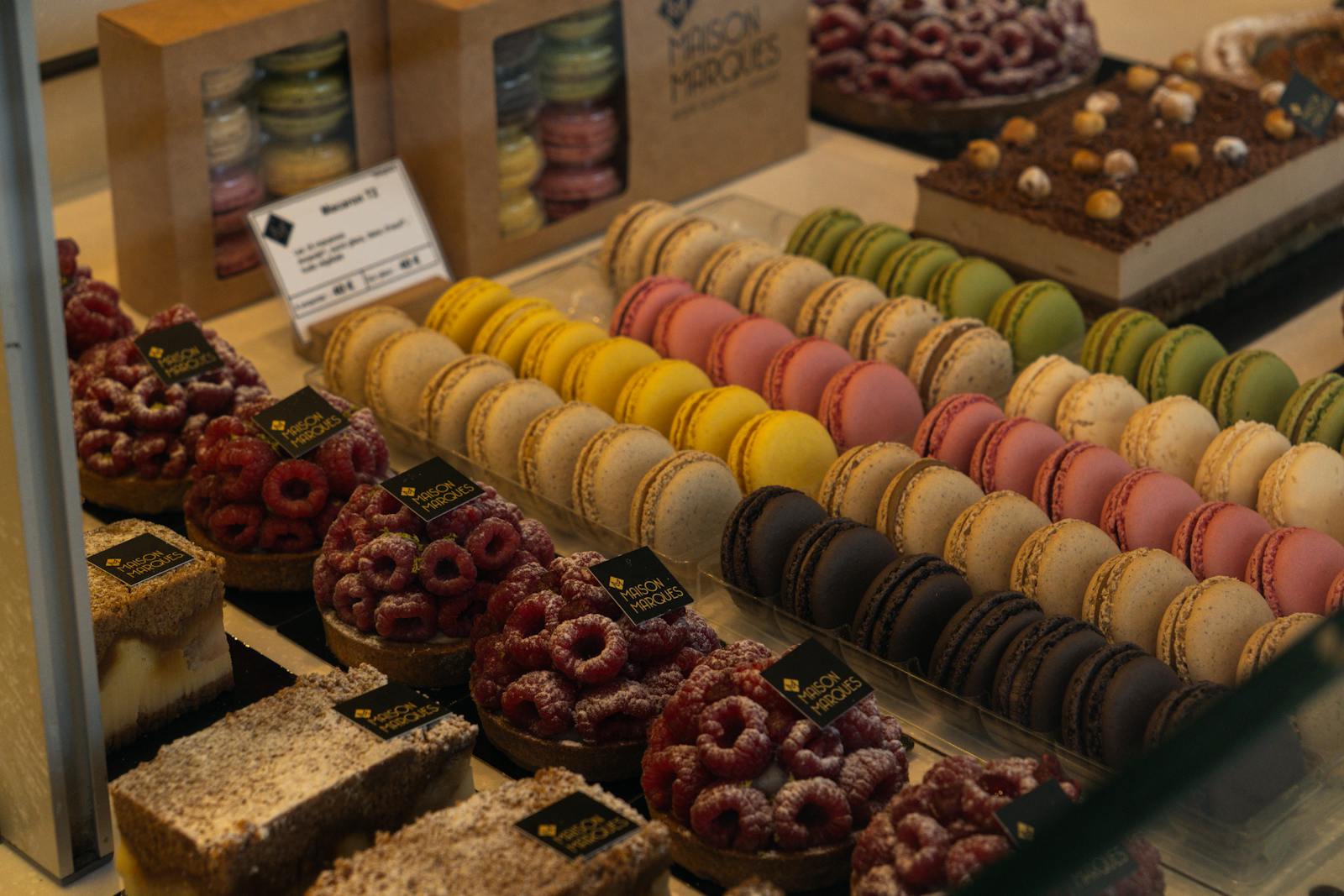 Parisian pâtisserie counter with macarons and pastries elegantly displayed