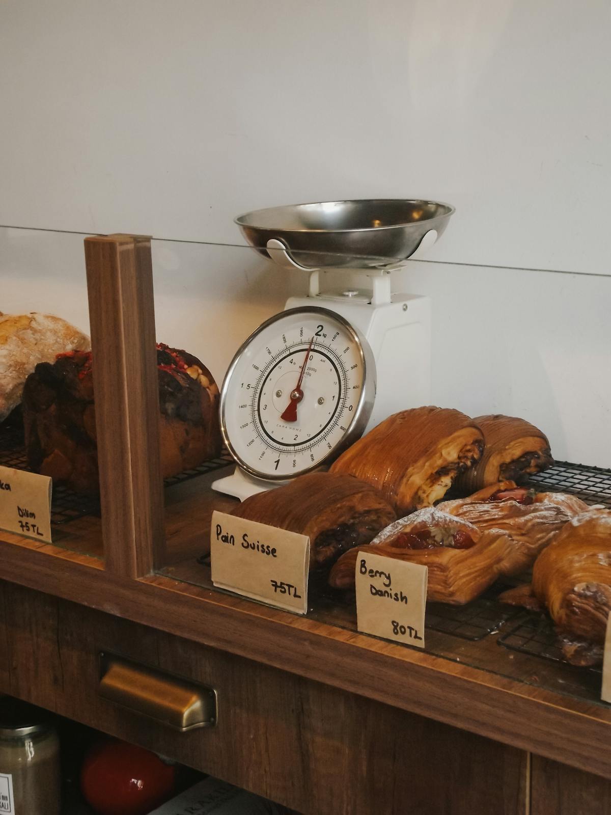 Variety of pastries on a bakery shelf
