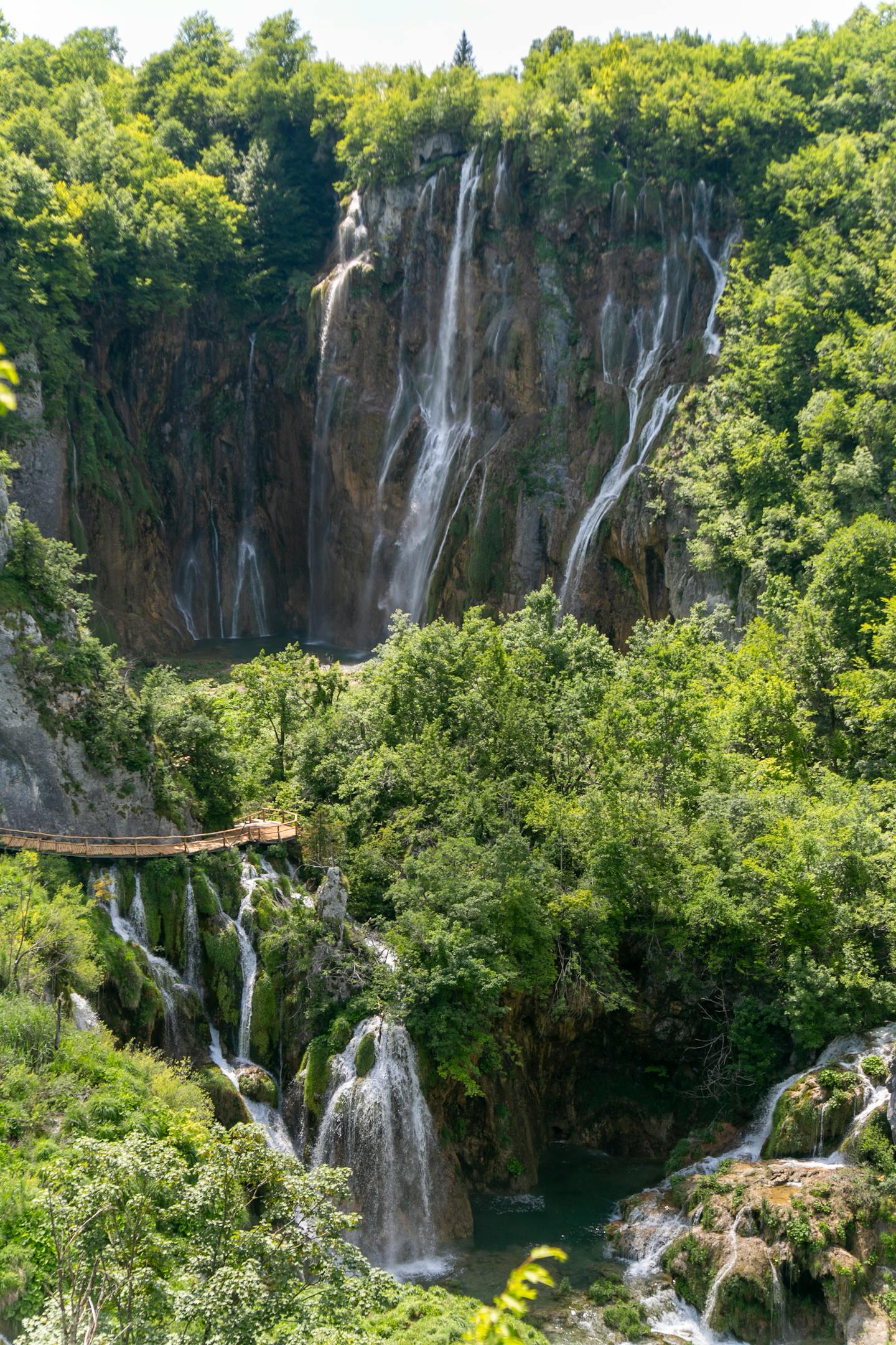 Plitvice Lakes waterfalls cascading through lush summer greenery
