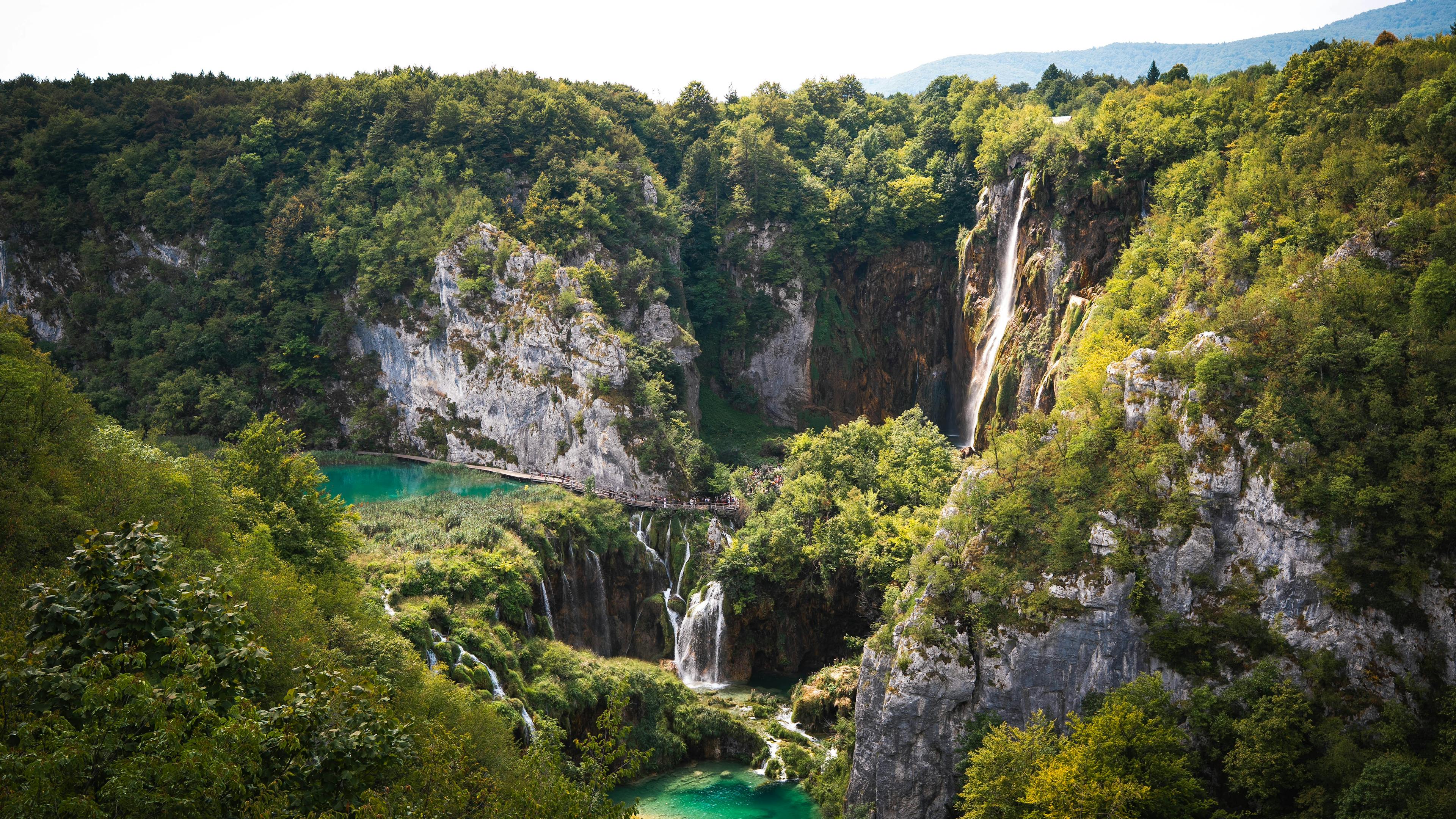 Stunning waterfall cascading through lush greenery at Plitvice Lakes National Park
