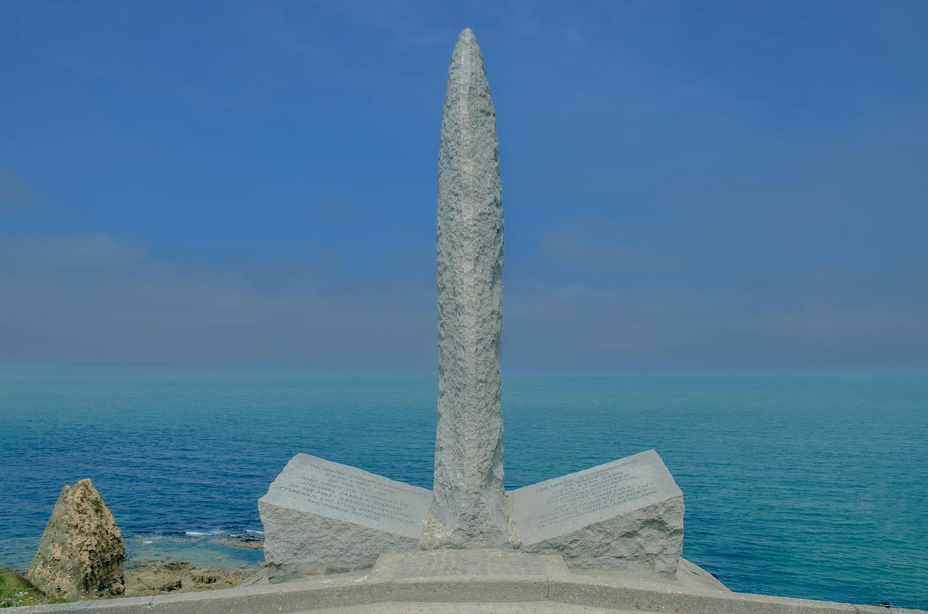 Pointe du Hoc Ranger monument in Normandy with the ocean in the background