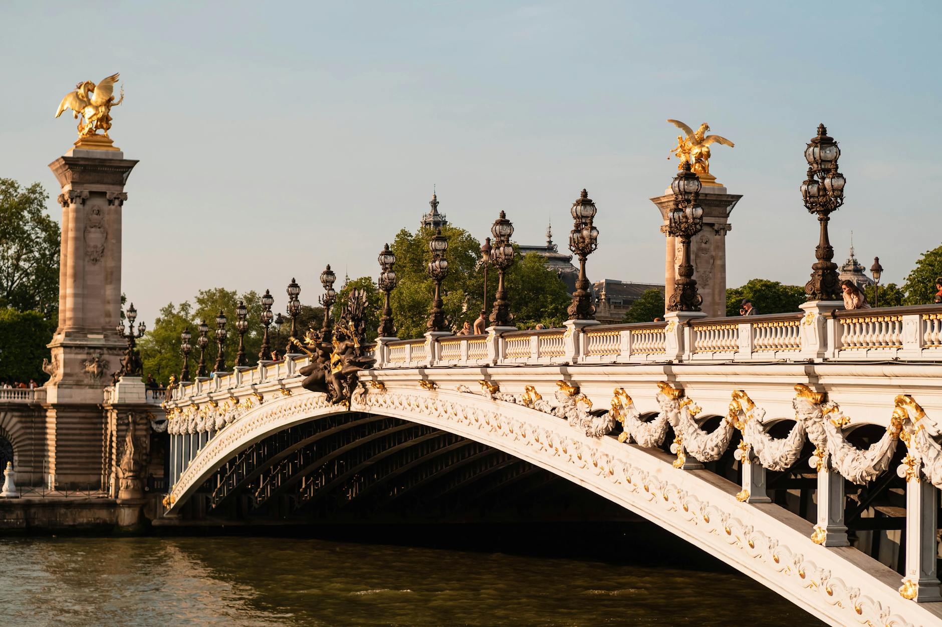 Golden winged statues on the Pont Alexandre III bridge over the Seine