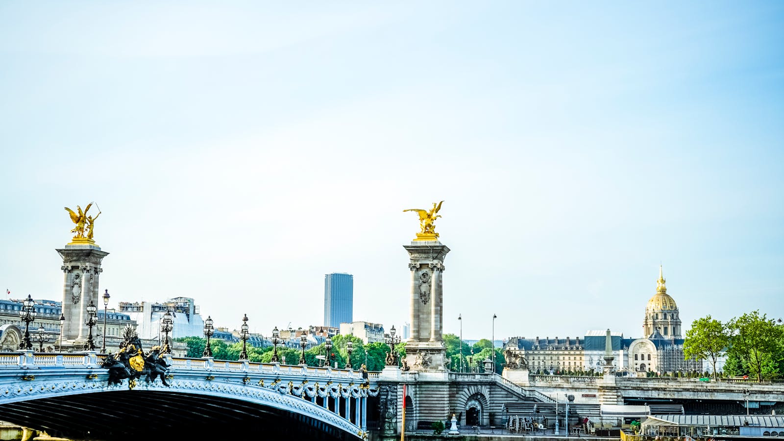 Golden statues on top of Pont Alexandre III in Paris