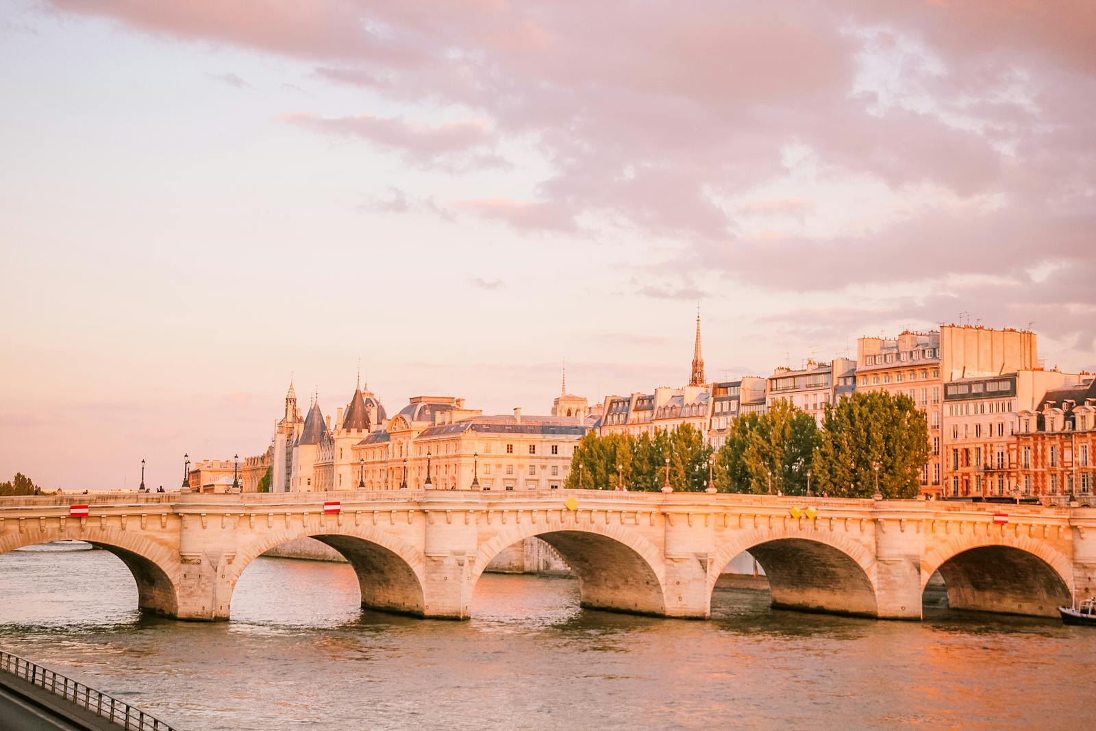 Pont Neuf bridge on the Seine River at sunset in Paris