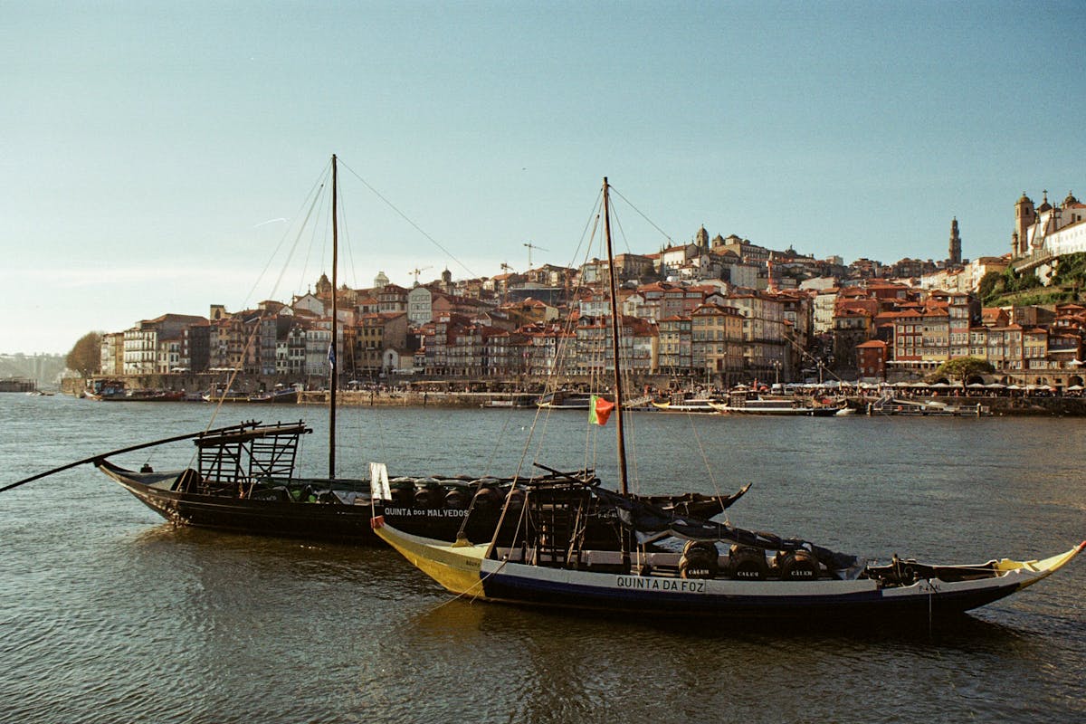 Traditional rabelo boats and historic buildings along the Douro in Porto