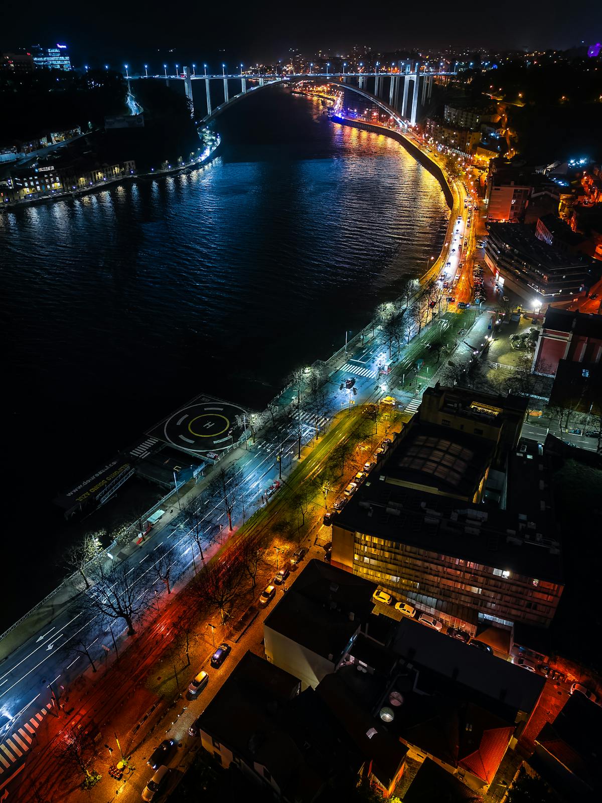 Aerial view of Porto at night with illuminated streets and the Douro River