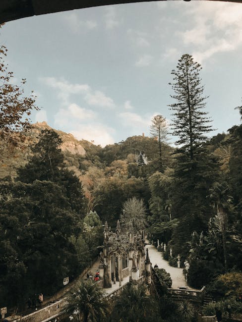 Gothic tower of Quinta da Regaleira surrounded by lush gardens